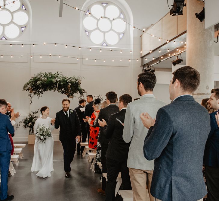 Bride in Homemade Wedding Dress and Groom in Reiss Suit Walking up the Aisle