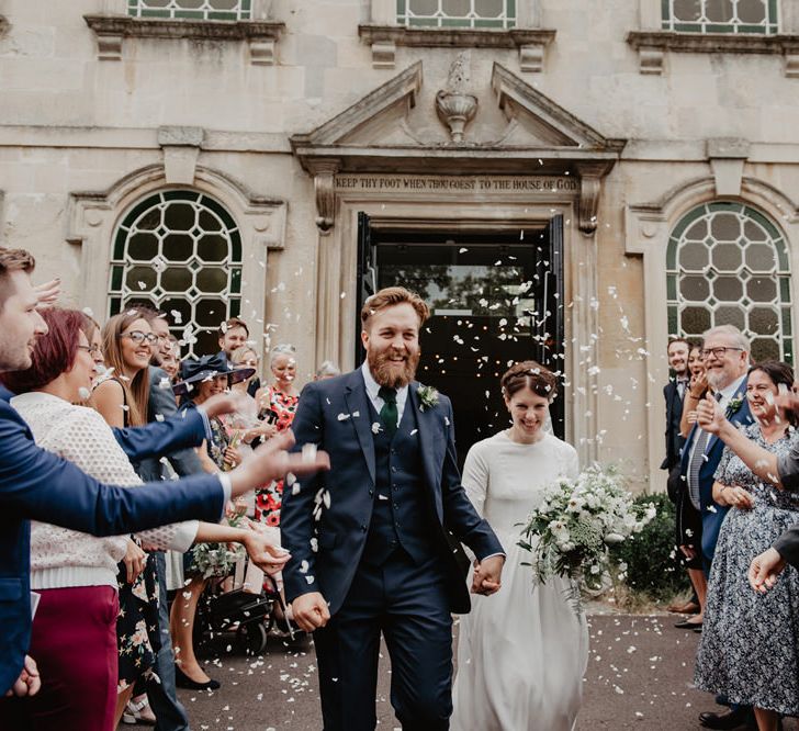 Confetti Moment with Bride in Homemade Wedding Dress and Groom in Reiss Suit