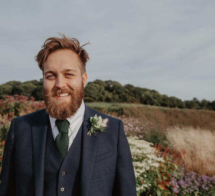 Bearded Groom in Three-Piece Navy Reiss Suit with Green Waffle Tie