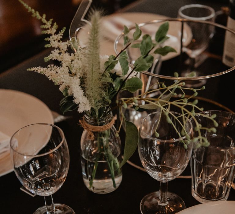 Minimalist Wedding Decor with Flowers in Bottles and Acrylic Name Tags