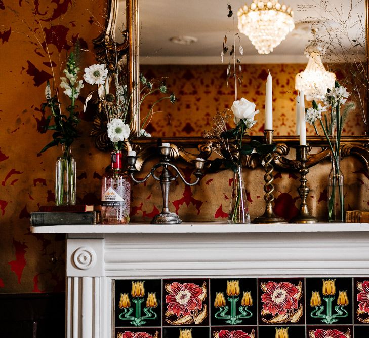 Flower Filled Mantle Piece Wedding Decor | Quirky Pub Wedding at The Bell in Ticehurst East Sussex | Epic Love Story Photography