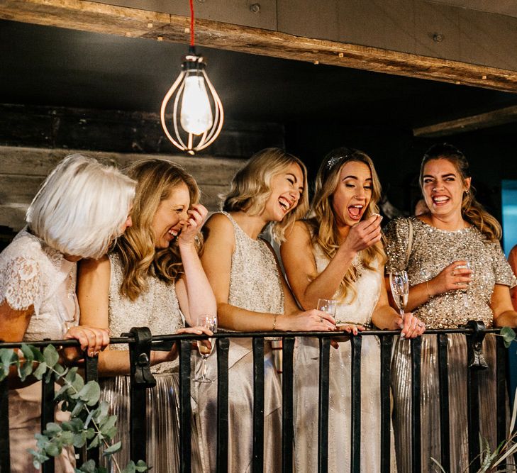 Bride in Charlie Brear Delancey Gown &amp; Belt | Bridesmaid in Metallic Skirt &amp; Sequin Top Separates | Quirky Pub Wedding at The Bell in Ticehurst East Sussex | Epic Love Story Photography