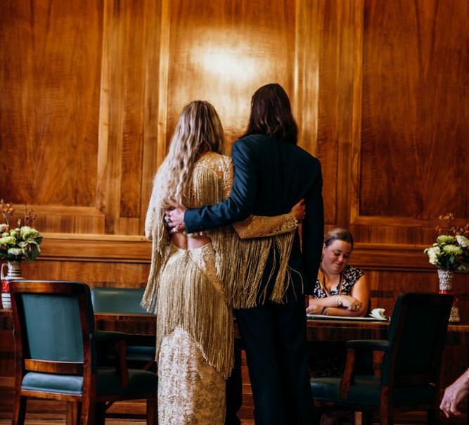 Bride and  Groom Embrace During Ceremony