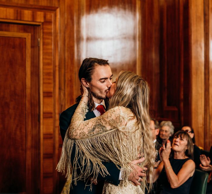 Bride and Groom Kiss During Ceremony