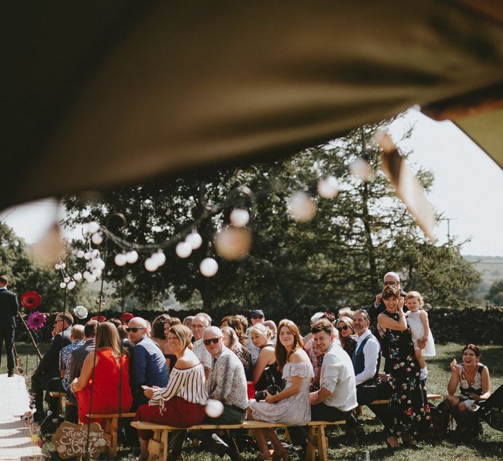 Guests turning to look at the bride