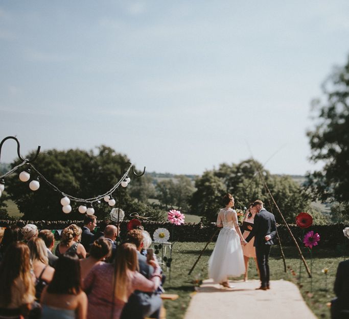 Bride and groom in outdoor ceremony