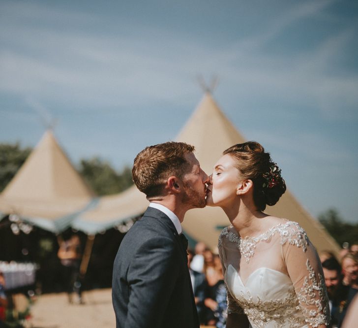 Bride and groom kissing