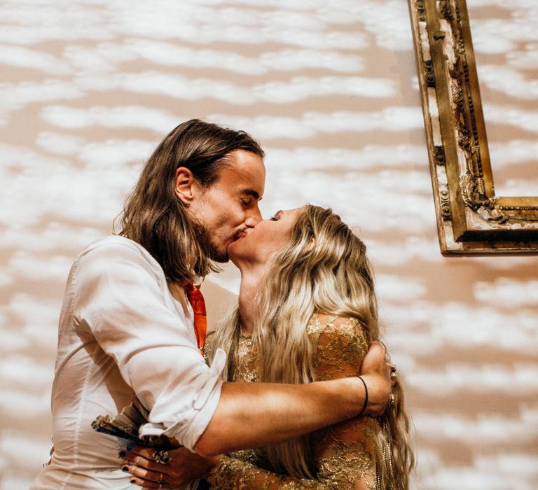 Bride and Groom Kiss During Reception