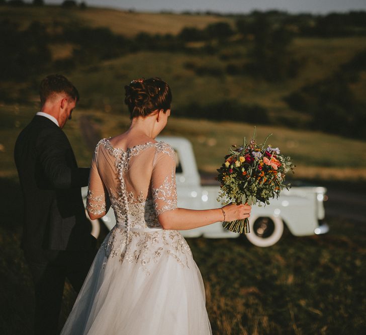 Bride and groom with vintage chevy truck