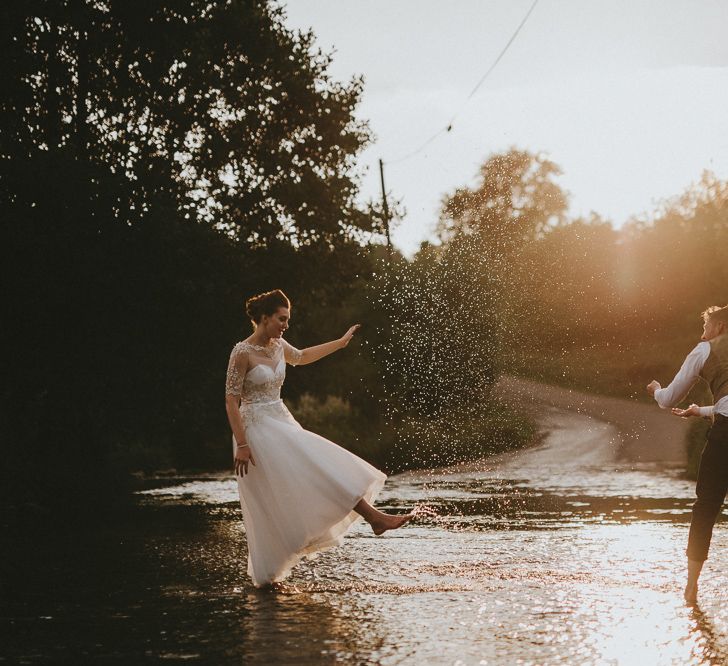 Bride and groom dancing in a ford