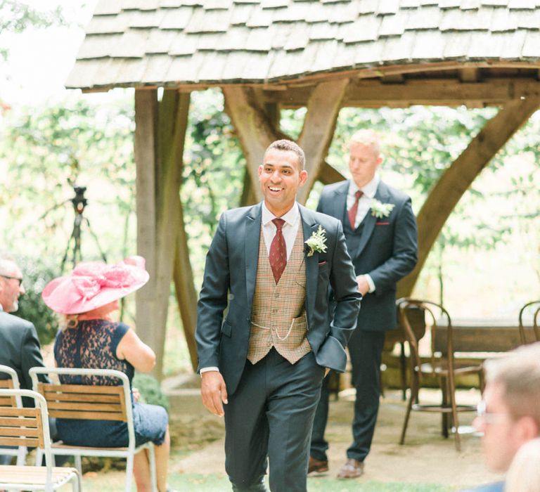 Groom in Dark Suit with Check Waistcoat and Burgundy Tie