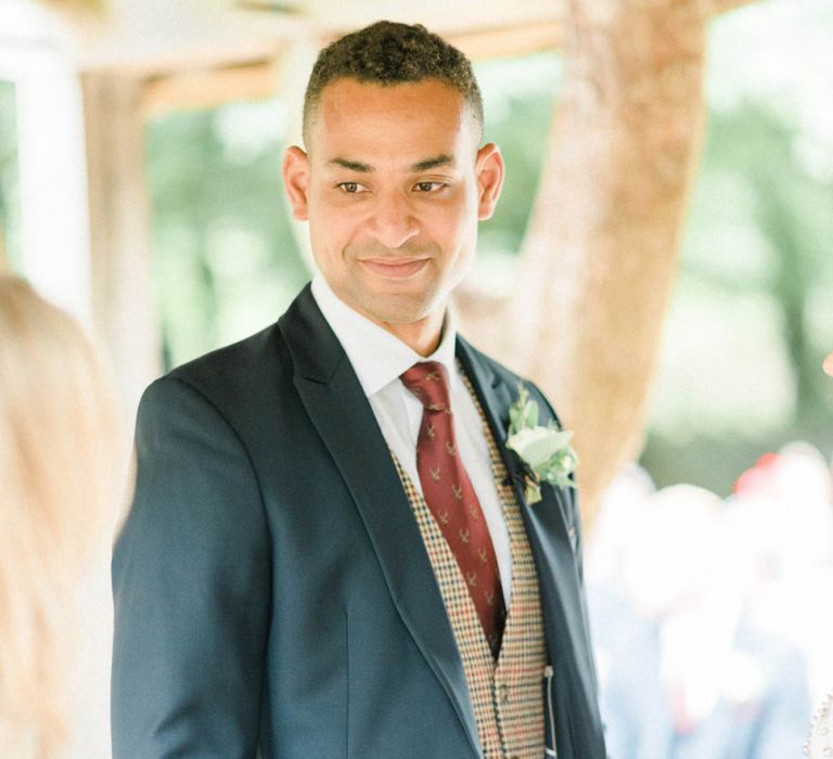 Groom at the Altar in Dark Suit, Brown Check Waistcoat and Burgundy Tie