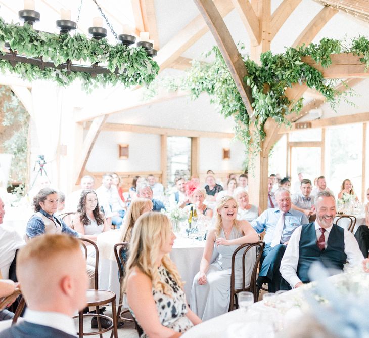 Laughing Wedding Guests During Wedding Reception Speeches