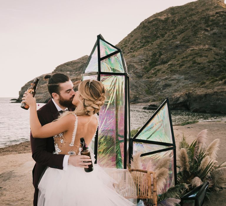 Bride and groom embrace