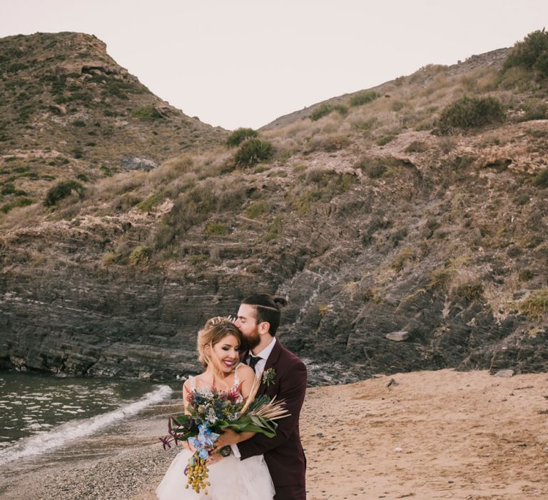 Bride and groom on Spanish beach