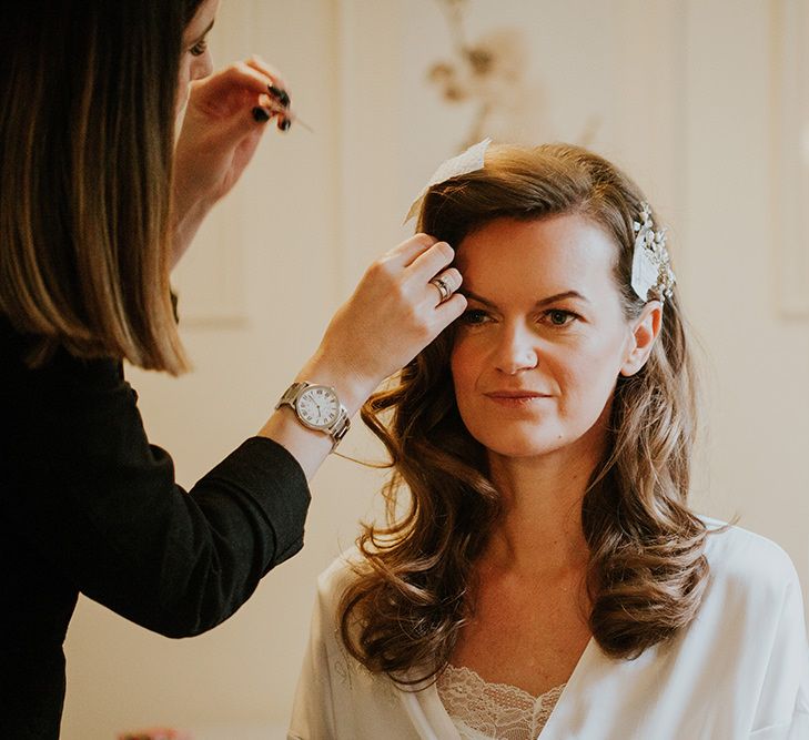 Bride has her hair styled