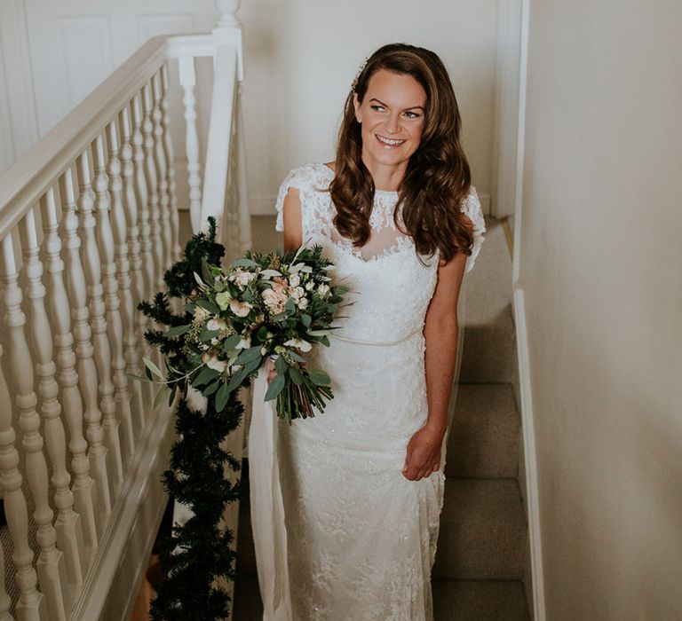 Bride makes her way to ceremony at Burley Manor