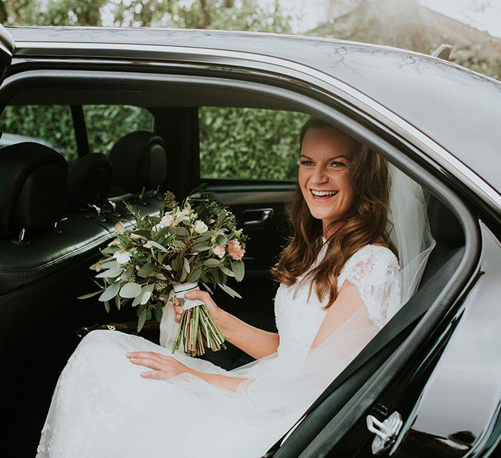 Bride arrives at wedding in car