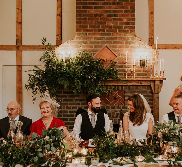 Top table wedding decor with Christmas tree for winter wedding