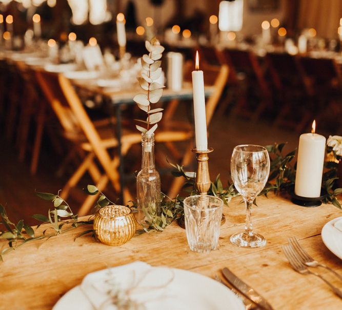 Candle wedding table decor with foliage table runner