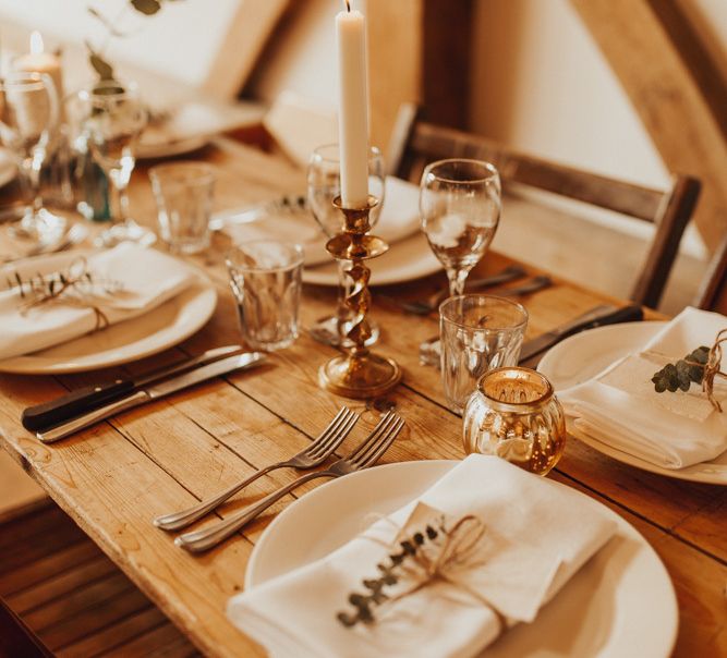 Wedding table decor with gold candlesticks