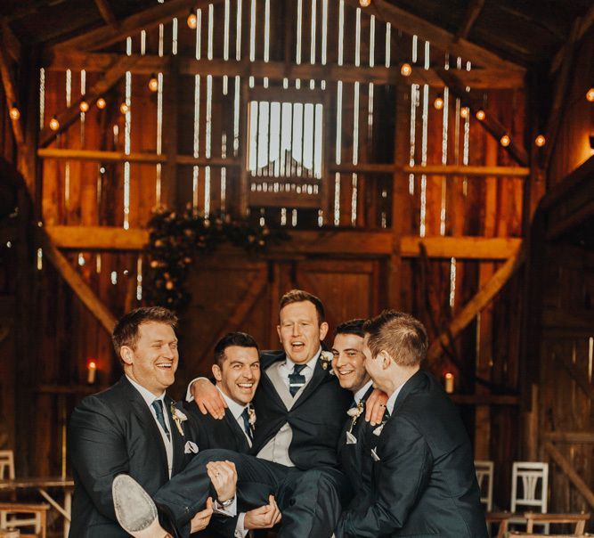 Groom and groomsmen in matching suits at Nancarrow Farm