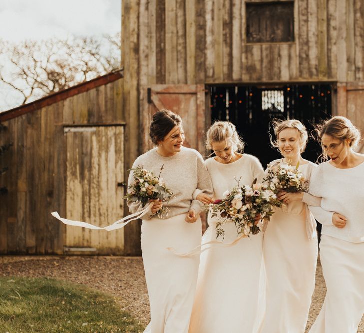 Bridal party wearing jumpers for Winter wedding