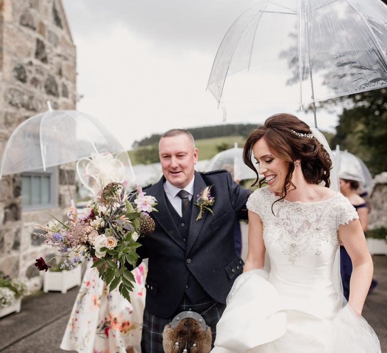 Bride in embellished top Ronald Joyce wedding dress by Aberdeen wedding photographer