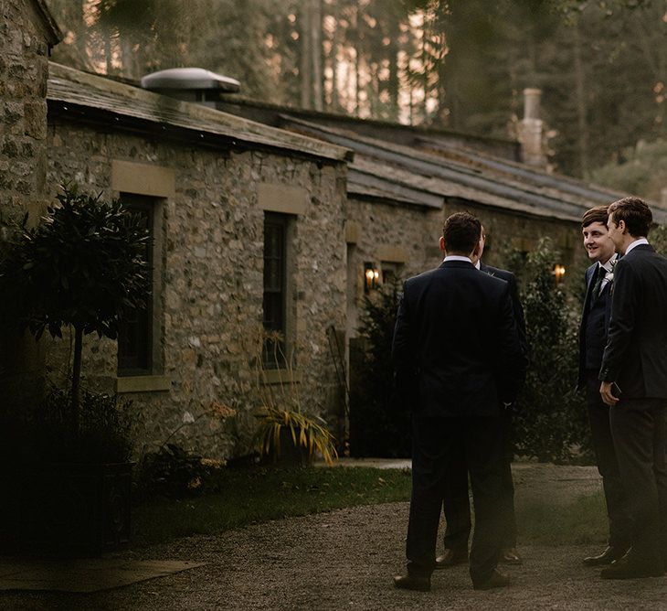 The Fig House at Middleton Lodge Wedding Venue | Groom in Navy Three-Piece Suit from Suit Supply with Green Tie | Groomsmen in Navy Marks &amp; Spencer Suits with Green Ties | Emerald Green Bridesmaid Dress for a Winter Wedding at Middleton Lodge | Georgina Harrison Photography