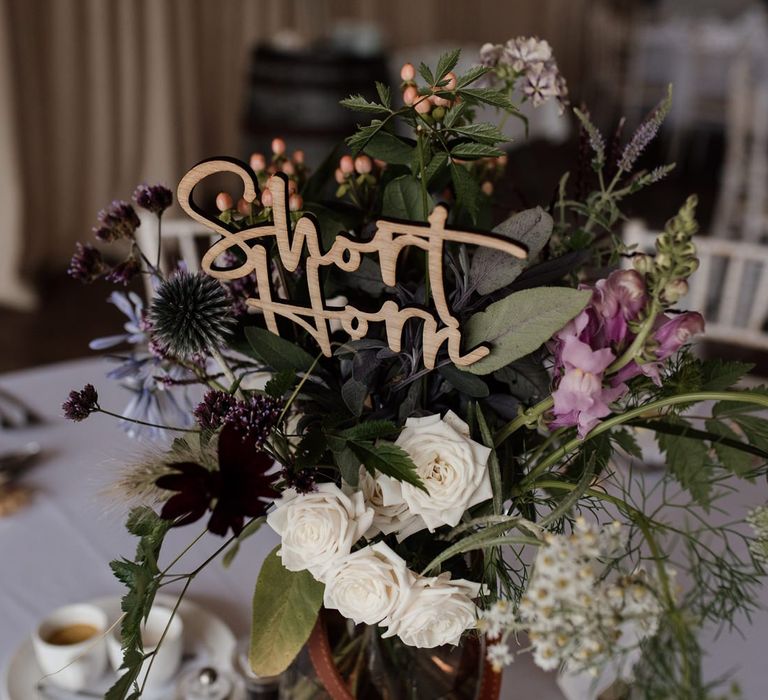 Wooden Etched Table Name Staked in Flower Centrepiece