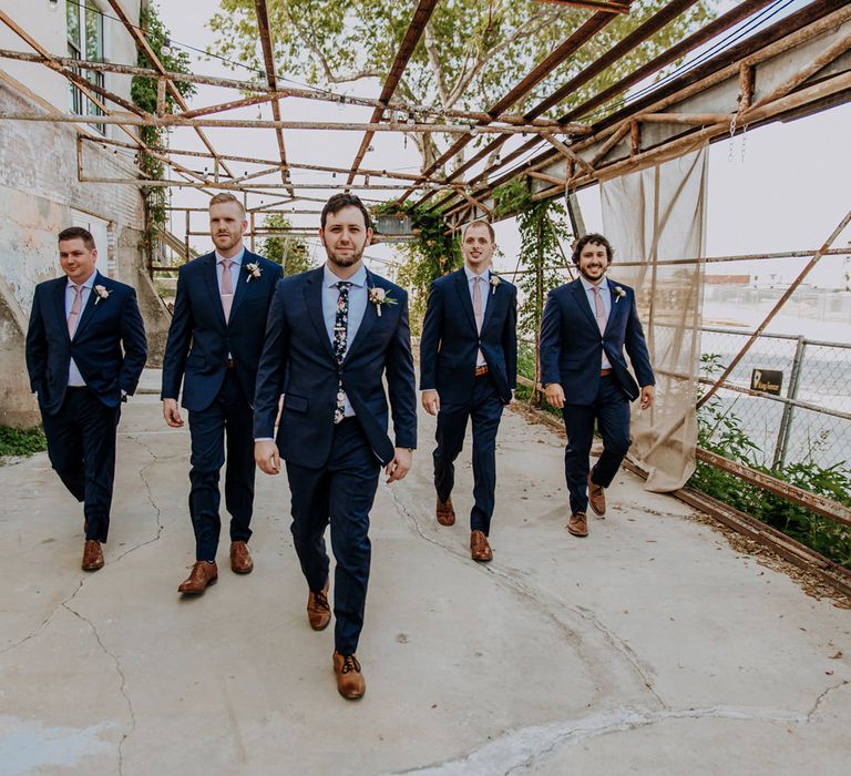 Groom in Navy Suit and Floral Tie | Groomsmen in Navy Suits and Silk Blush Ties | Pink Buttonholes | Rifle Paper Co. Trainers for Informal Wedding in Fort Worth, Texas | Paul &amp; Nanda Photography