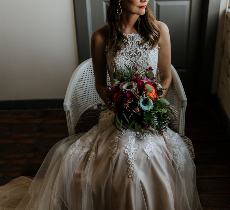 Bride in Sleeveless High-Neck Stella York Gown with Lace Overlay and Gold Underskirt | Half Up Half Down Wedding Hair | Bride Wearing Red Lipstick | Colourful Bridal Bouquet of Pink, Orange and White Flowers with Ferns, Eucalyptus and Greenery | Rifle Paper Co. Trainers for Informal Wedding in Fort Worth, Texas | Paul &amp; Nanda Photography