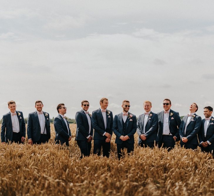 Groom and groomsmen in matching suits