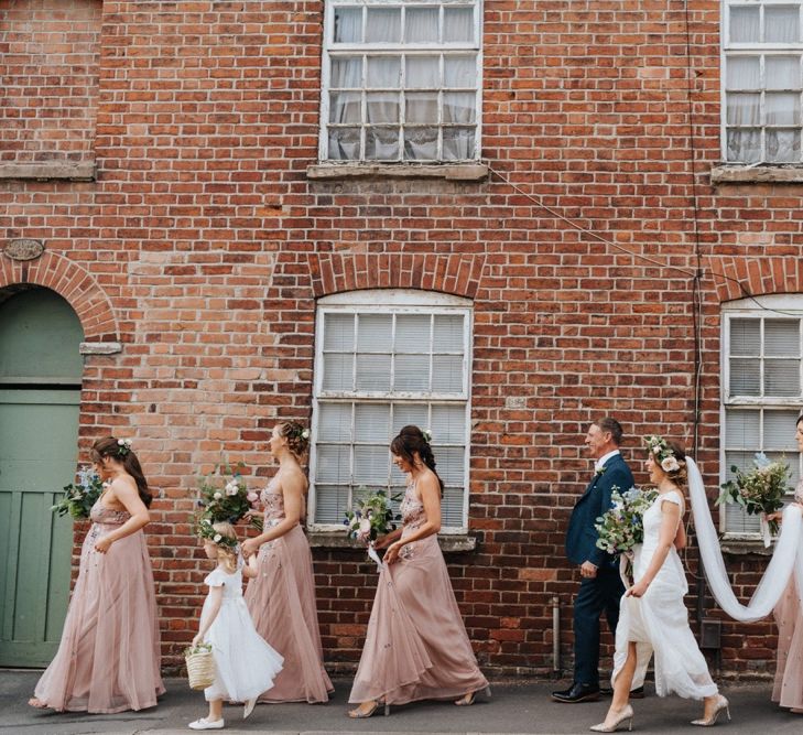 Bridal party make their way to ceremony