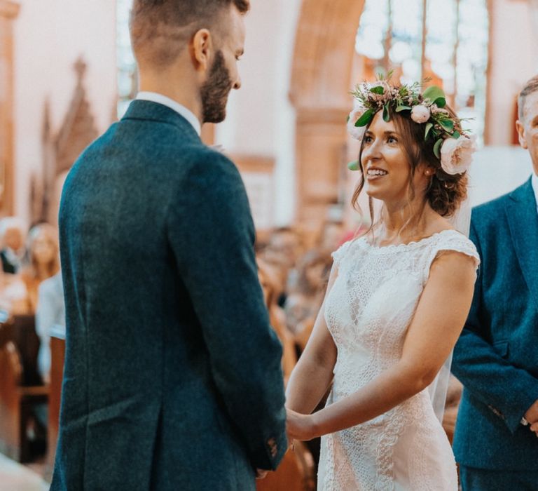 Bride in lace wedding dress with flower crown