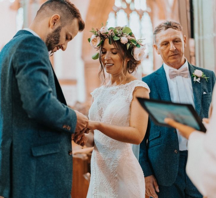 Bride in lace wedding dress with flower crown