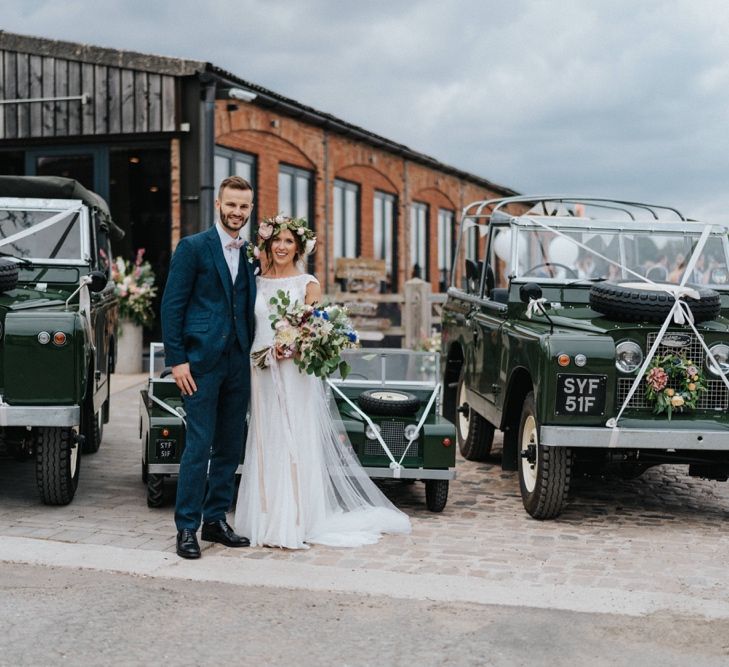 Bride and groom with wedding transport and DIY wedding decor