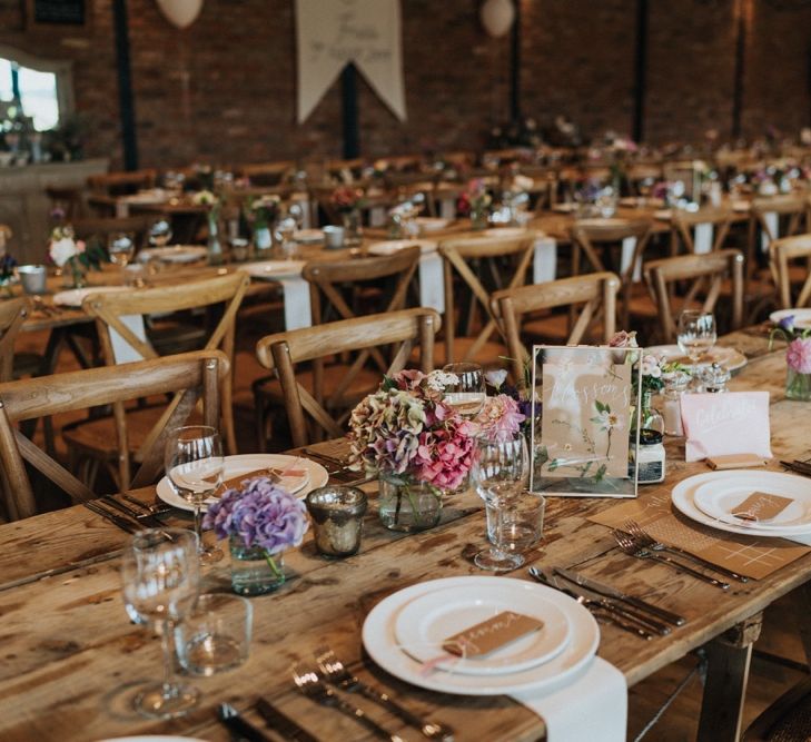 Beautiful rustic wedding setting with pastel flowers