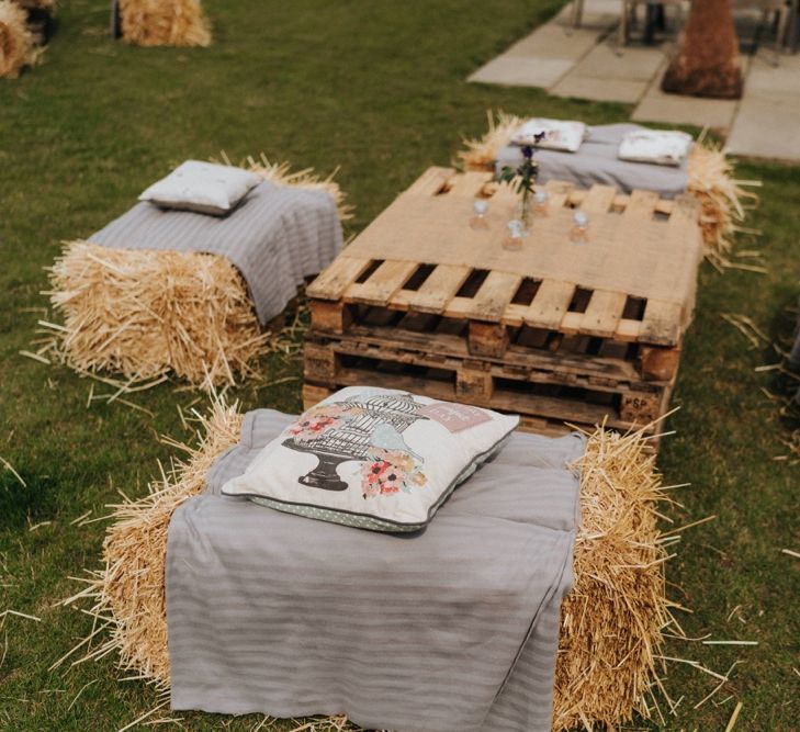 Outdoor seating area at rustic barn wedding