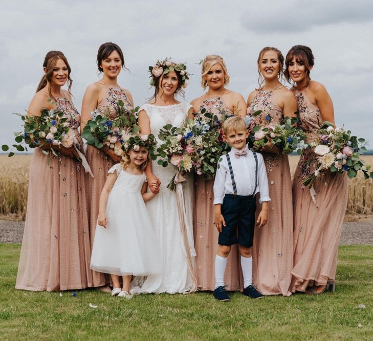 Bridal party in pink bridesmaid dresses