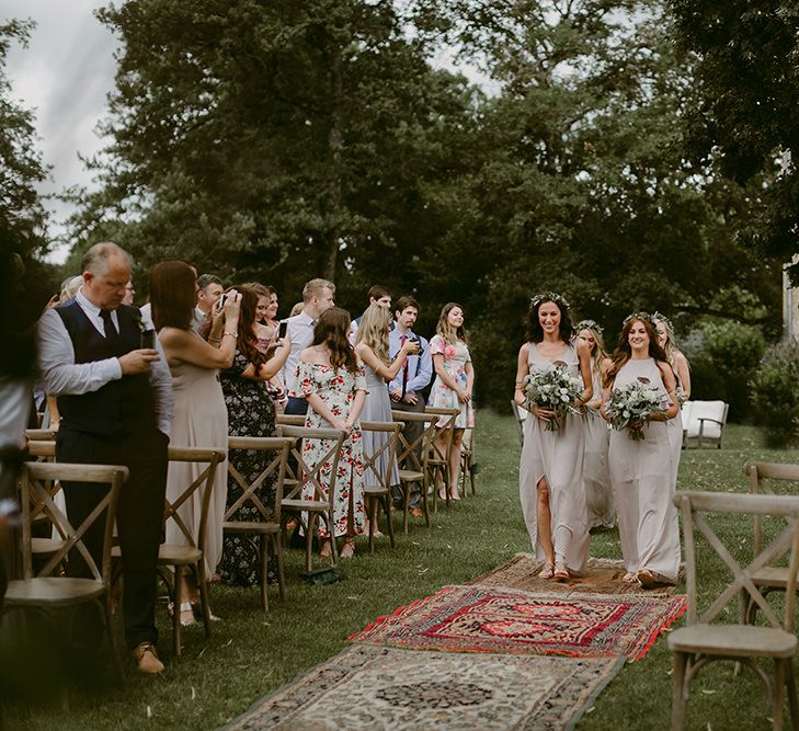 Outdoor Wedding Ceremony | Bridesmaid Entrance in Show me Your Mumu Dresses | Persian Rug, &amp; Floral Arch Aisle &amp; Altar Wedding Decor | Outdoor Boho Wedding at Chateau le Tour, France | Adam and Grace Photography | Head and Heart Films