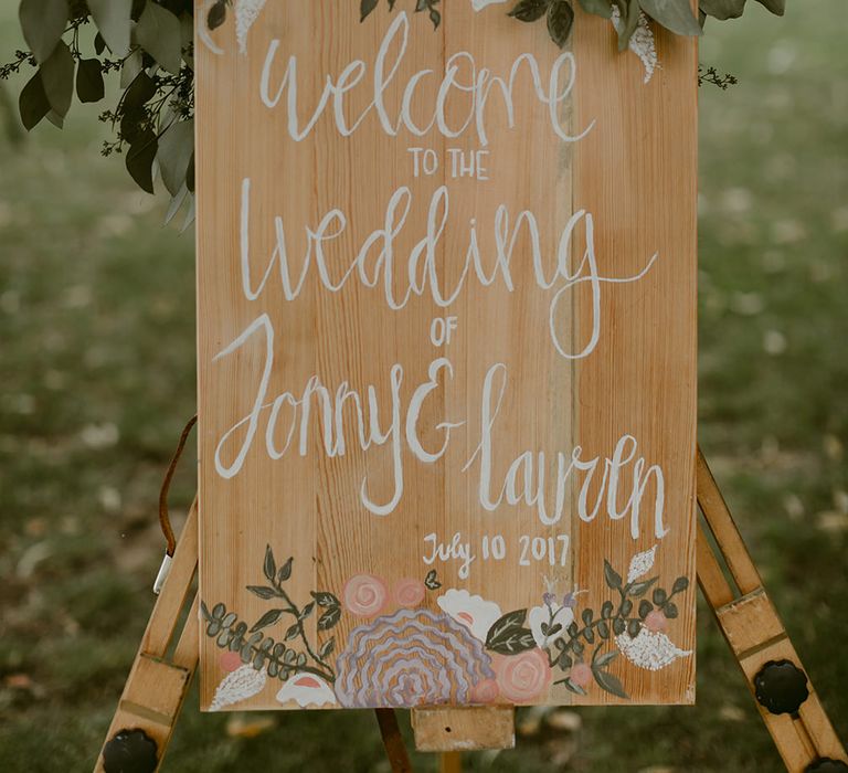 Wooden Wedding Welcome Sign with Greenery Decor | Outdoor Boho Wedding at Chateau le Tour, France | Adam and Grace Photography | Head and Heart Films