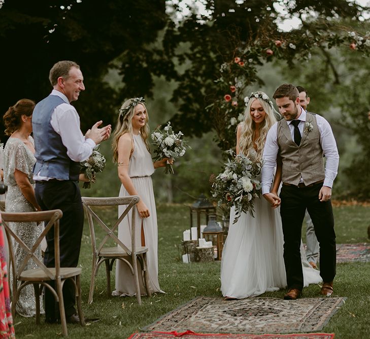 Outdoor Wedding Ceremony | Bride in Daalarna Gown | Groom in Waistcoat | Persian Rug, &amp; Floral Arch Aisle &amp; Altar Wedding Decor | Outdoor Boho Wedding at Chateau le Tour, France | Adam and Grace Photography | Head and Heart Films