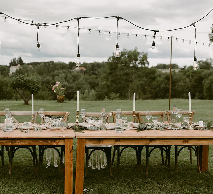 Trestle Tablescape | Festoon Lit Outdoor Boho Wedding at Chateau le Tour, France | Adam and Grace Photography | Head and Heart Films