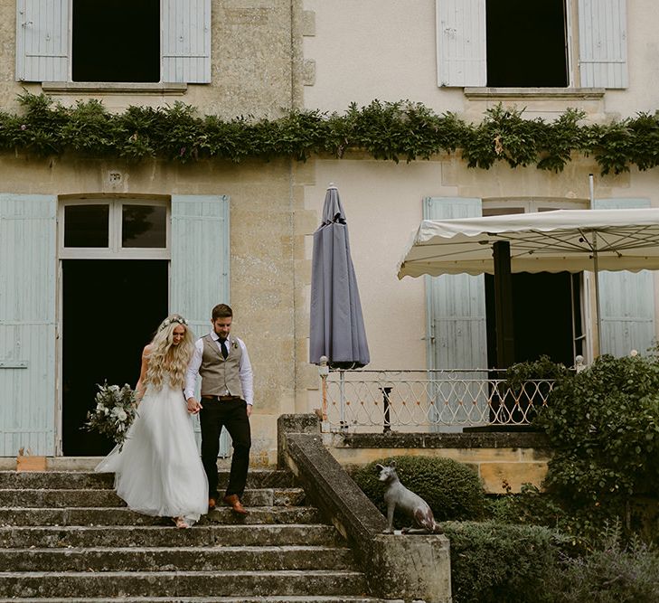 Bride in Daalarna Bridal Gown | Groom in Waistcoat | Festoon Lit Outdoor Boho Wedding at Chateau le Tour, France | Adam and Grace Photography | Head and Heart Films