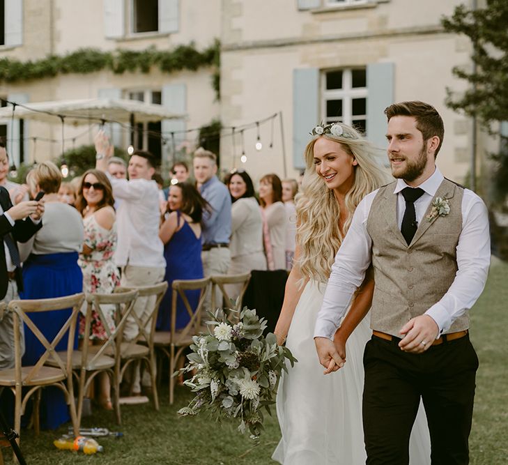 Bride in Daalarna Bridal Gown | Groom in Waistcoat | Festoon Lit Outdoor Boho Wedding at Chateau le Tour, France | Adam and Grace Photography | Head and Heart Films