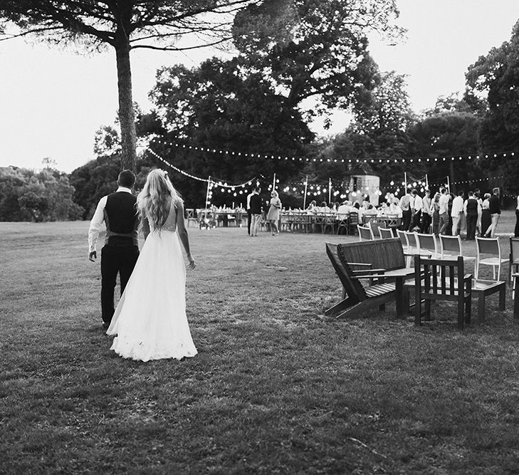 Bride in Daalarna Bridal Gown | Groom in Waistcoat | Festoon Lit Outdoor Boho Wedding at Chateau le Tour, France | Adam and Grace Photography | Head and Heart Films