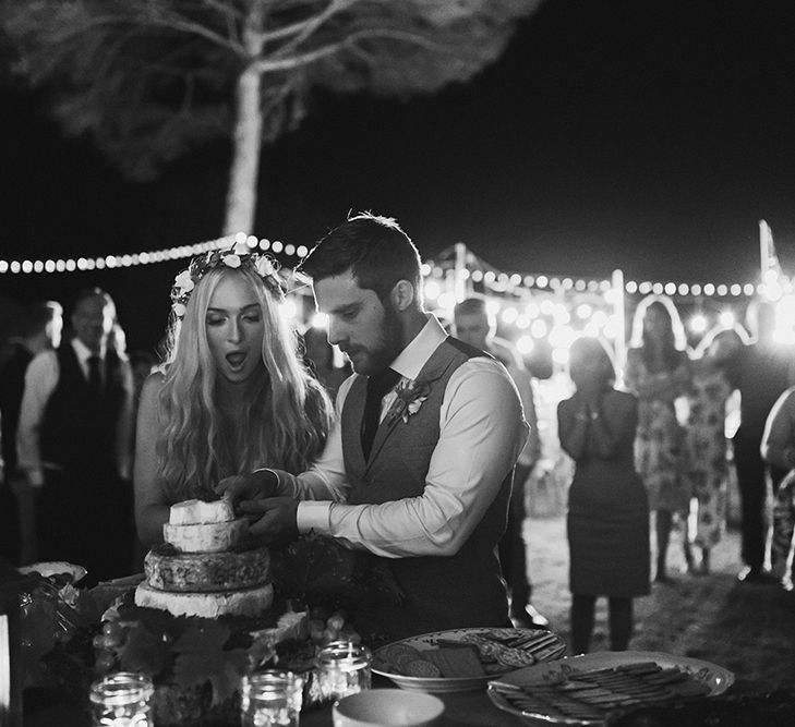 Cutting the Cake | Bride in Daalarna Bridal Gown | Groom in Waistcoat | Outdoor Boho Wedding at Chateau le Tour, France | Adam and Grace Photography | Head and Heart Films