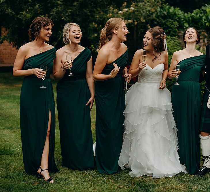 Green bridesmaid dresses with bride in layered wedding dress