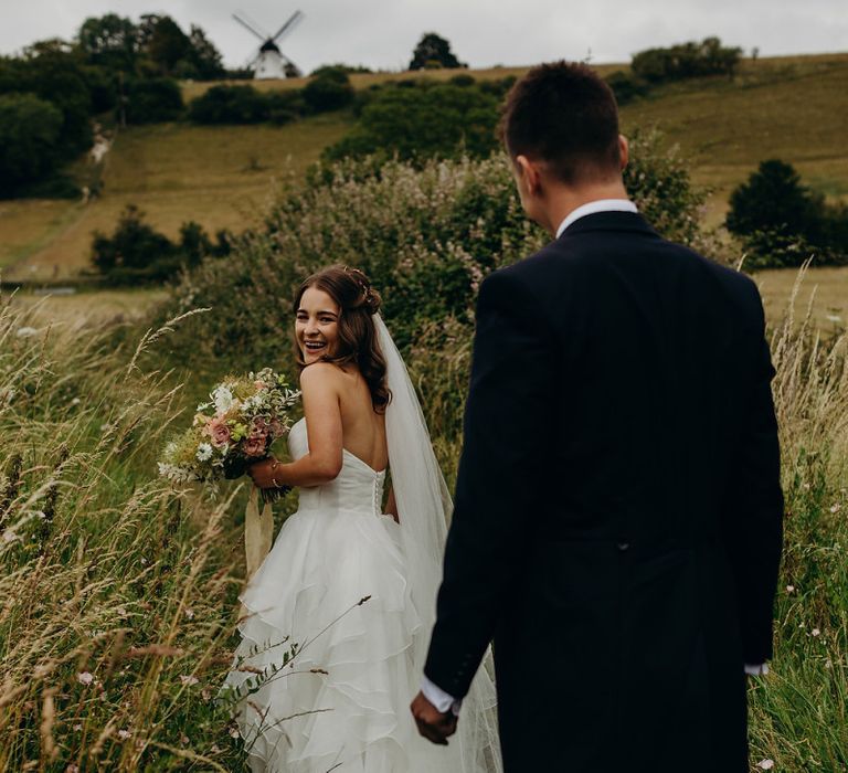 Bride in layered wedding dress with no straps